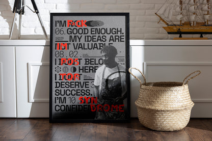 Framed Impostor Syndrome poster with bold typography and red brushstrokes symbolizing creative empowerment, placed in a room with a basket and vintage sailor boat on a shelf.