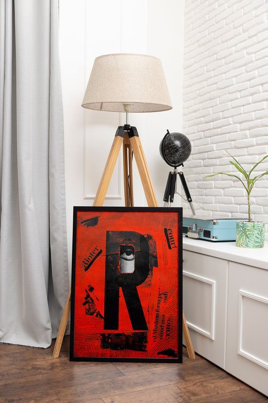 Racism poster framed in black, showcasing real newspaper clippings and a cut-out letter 'R' with a single sorrowful African eye, displayed in an adventure-themed room with a globe.